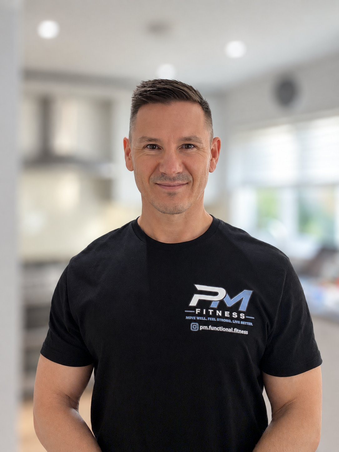 Paul Minihane wearing his PM Fitness shirt
